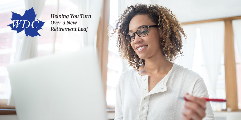 Black woman looking at her laptop with pen on her left hand. Photo includes WDC logo with text, "Helping You Turn Over a New Retirement Leaf"