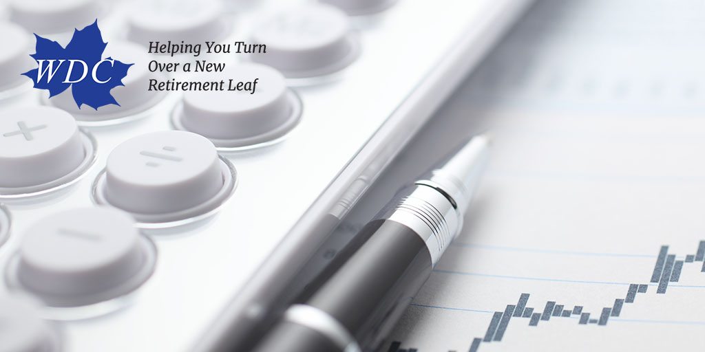 White calculator, pen and chart signifying WDC's mission of helping you turn over a new retirement leaf