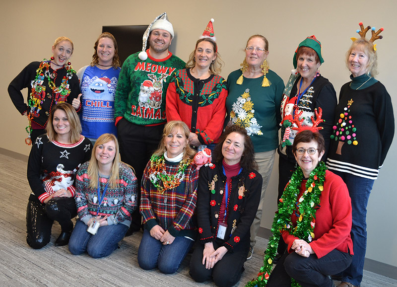 Staff in ugly holiday sweaters