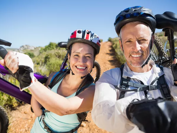 Middle age couple with mountain bikes.