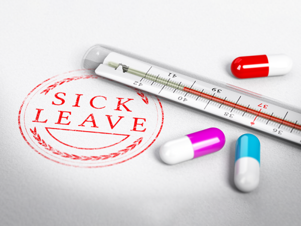 A stamp with the words Sick Leave in red and two red laurels above and below it in a circle, a thermometer, and three pills.