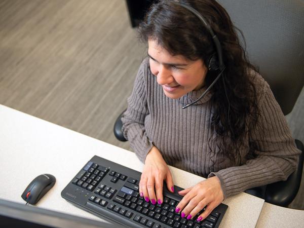 Call center employee working at a computer