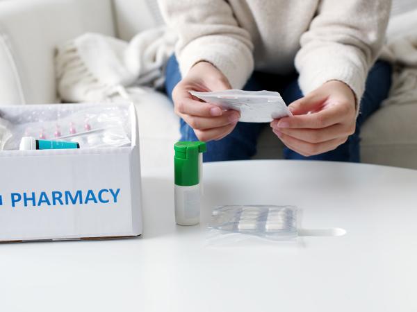 Delivery box with medications sitting on table