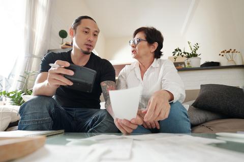 mother and son reviewing finances