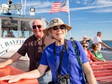 Retiree couple on a boat.