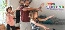 Dad dancing with his two children.