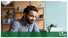 Man working at a computer.