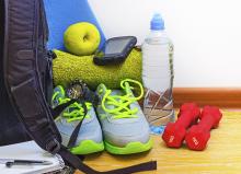 Gym bag with shoes, weights, water bottle and towel